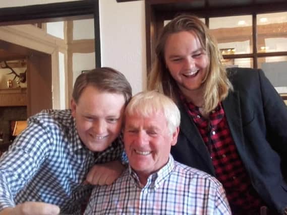 Former Lancashire Evening Post studio manager and cartoonist Ken Wignall celebrating his 80th birthday with eldest grandchildren Ben and Sam